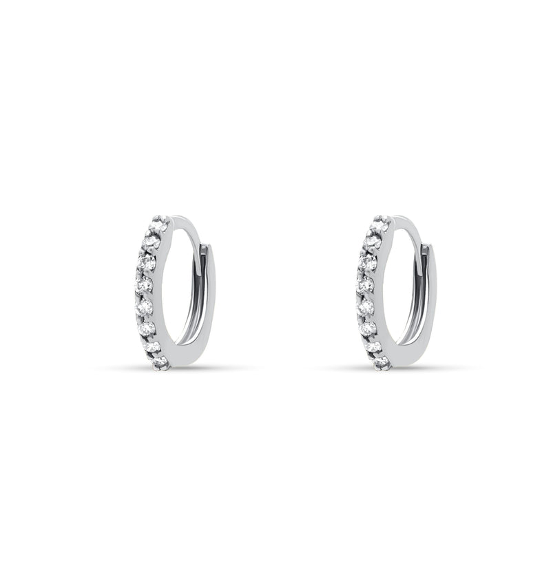 white gold. Our 14 karat gold huggie earrings feature handset diamond pave stones and are the ultimate essential for an every day sophisticated look.