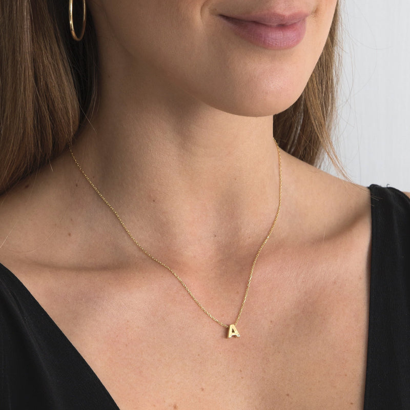 A 18 karat gold vermeil necklace with your initial letter "A". This diamond letter necklace is a special jewelry necklace that can be worn day and night. A genuine diamond stone in the corner of the letter makes this gold diamond necklace a luxury and ideal gift for yourself, your best friend or loved one. 