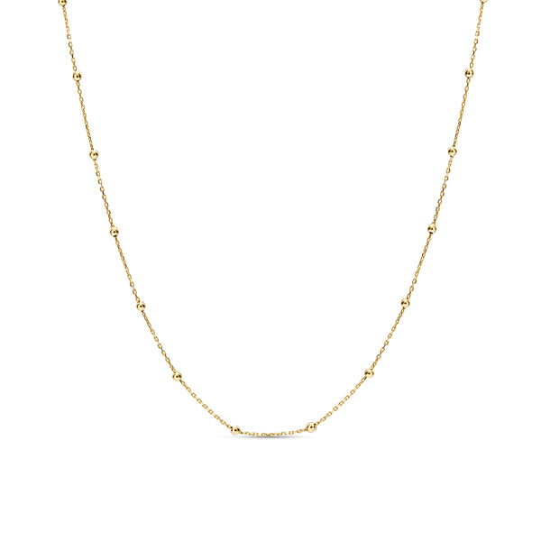 This ball chain necklace in 14 karat gold features petit balls aligned along the gold chain. Wear it by itself or combine with other gold necklaces for the ultimate layering look.