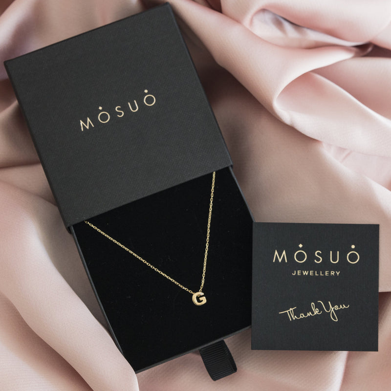 A 18 karat gold vermeil necklace with your initial letter "G". This diamond letter necklace is a special jewelry necklace that can be worn day and night. A genuine diamond stone in the corner of the letter makes this gold diamond necklace a luxury and ideal gift for yourself, your best friend or loved one.