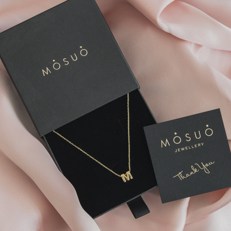 A 18 karat gold vermeil necklace with your initial letter "M". This diamond letter necklace is a special jewelry necklace that can be worn day and night. A genuine diamond stone in the corner of the letter makes this gold diamond necklace a luxury and ideal gift for yourself, your best friend or loved one.