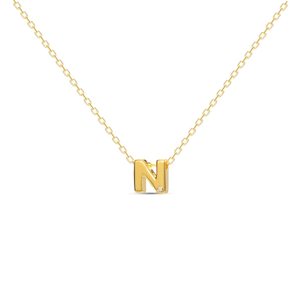 A 18 karat gold vermeil necklace with your initial letter "N". This diamond letter necklace is a special jewelry necklace that can be worn day and night. A genuine diamond stone in the corner of the letter makes this gold diamond necklace a luxury and ideal gift for yourself, your best friend or loved one. 