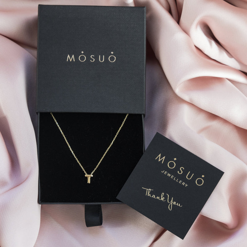 A 18 karat gold vermeil necklace with your initial letter "T". This diamond letter necklace is a special gold necklace that can be worn day and night. A genuine diamond stone in the corner of the letter makes this gold diamond necklace a luxury and ideal gift for yourself, your best friend or loved one.
