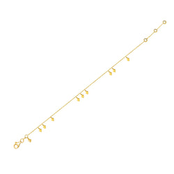 This 14 karat gold ankle bracelet will add some sparkle to your ankle!   This delicate and playful gold anklet features dangling tribal gold charms. Its simple style mixes and matches easily with other jewels and is the perfect accessory for a boho- glam look.