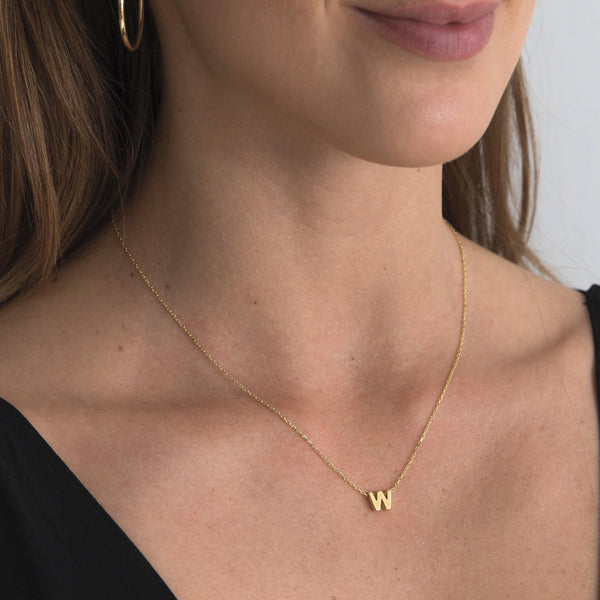 A 18 karat gold vermeil necklace with your initial letter "W". This diamond letter necklace is a special gold necklace that can be worn day and night. A genuine diamond stone in the corner of the letter makes this gold diamond necklace a luxury and ideal gift for yourself, your best friend or loved one. 