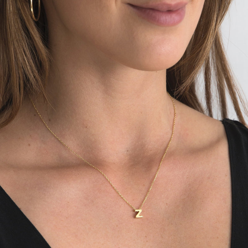 A 18 karat gold vermeil necklace with your initial letter "Z. This diamond letter necklace is a special gold necklace that can be worn day and night. A genuine diamond stone in the corner of the letter makes this gold diamond necklace a luxury and ideal gift for yourself, your best friend or loved one. 