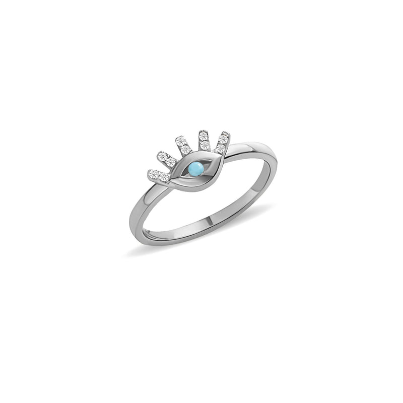 This 14 karat gold diamond ring is our dream jewelry piece. The turquoise stone in the center of the eye is encased with pave set diamond lashes. A magical gold ring that lasts a lifetime.